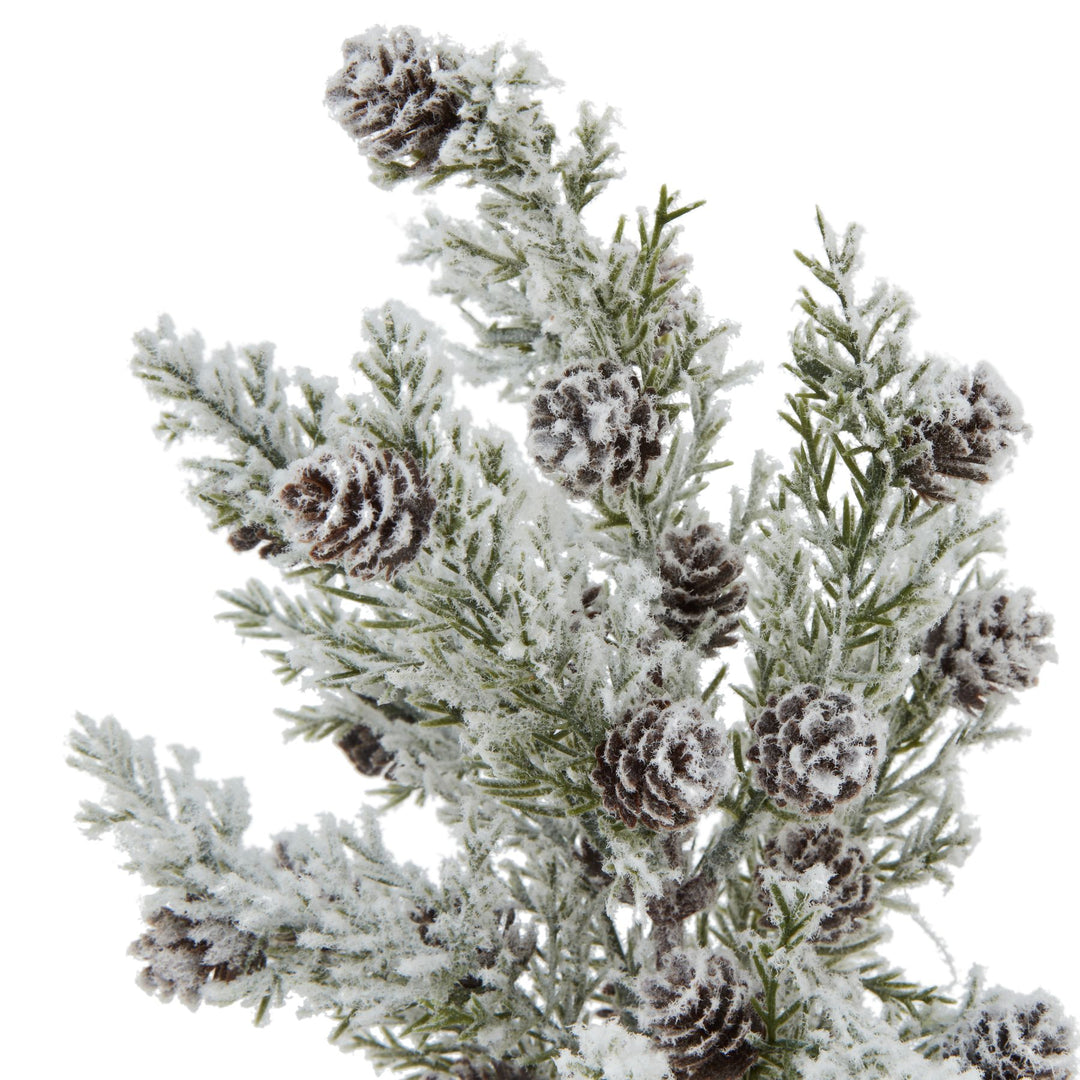 Small-Snowy-Fir-Tree-With-Pinecones-In-Wood-Log