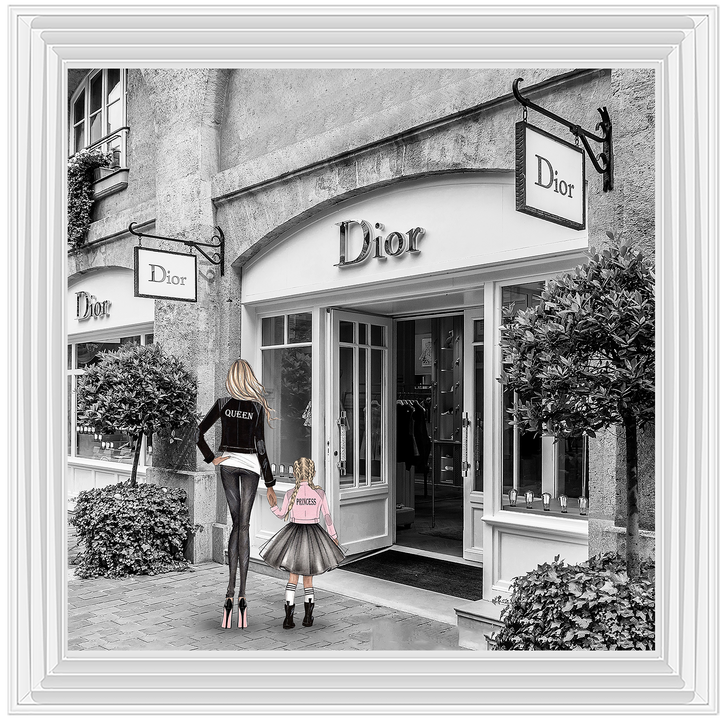 Mother and daughter in front of shop